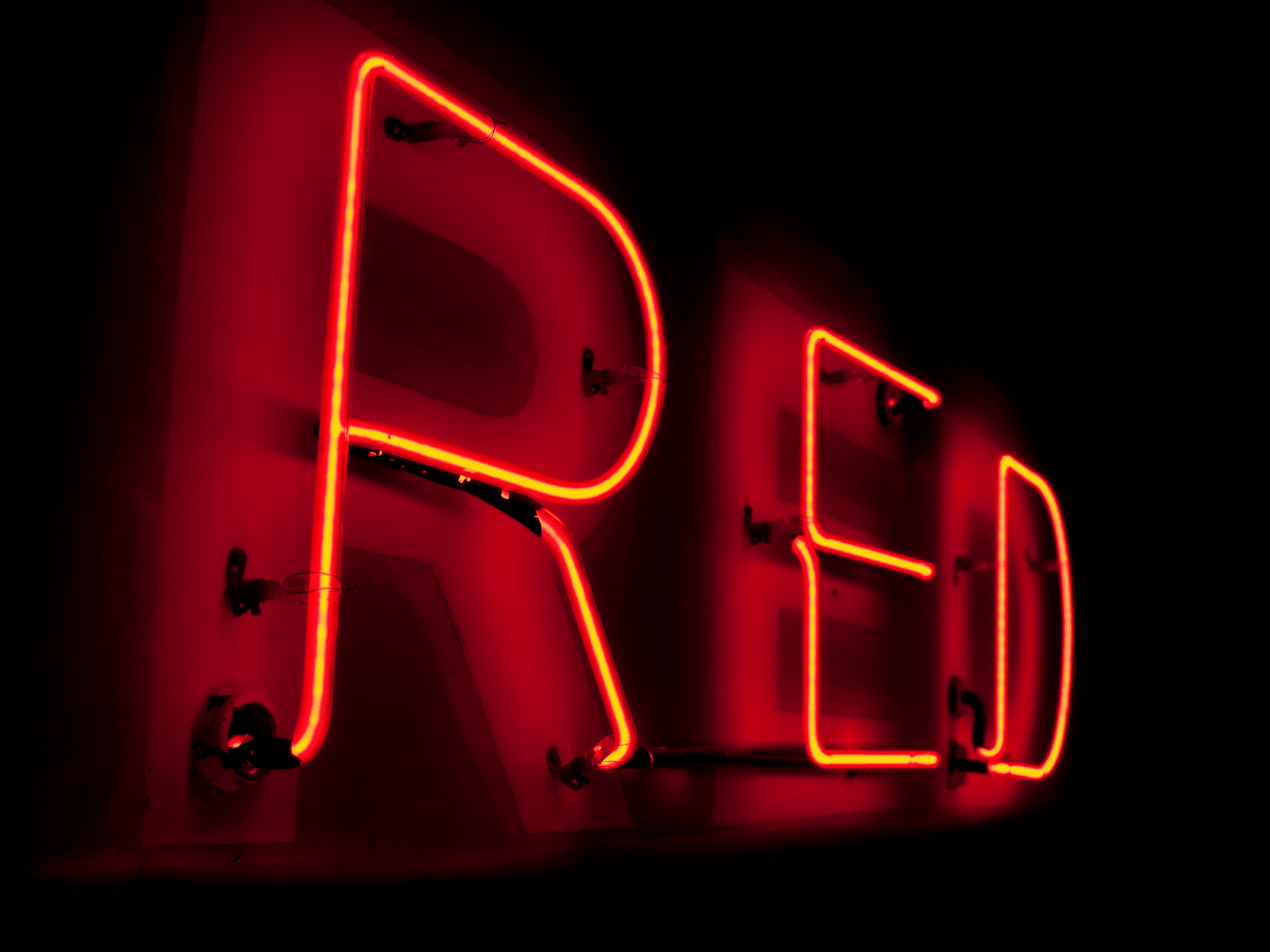 neon sign that says RED